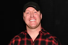Kroy Biermann in a black and red flannel shirt, smiling