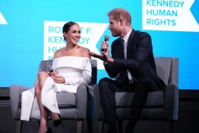 Meghan Markle in a white dress sitting with Prince Harry on stage at the Robert F Kennedy Human Rights Ripple of Hope Gala
