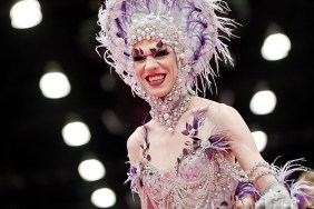 Utica Queen in a purple and silver head dress at Drag Con 2024