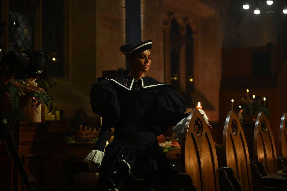 Lisa Rinna wearing the cursed amulet on The Traitors Season 4 Episode 7 